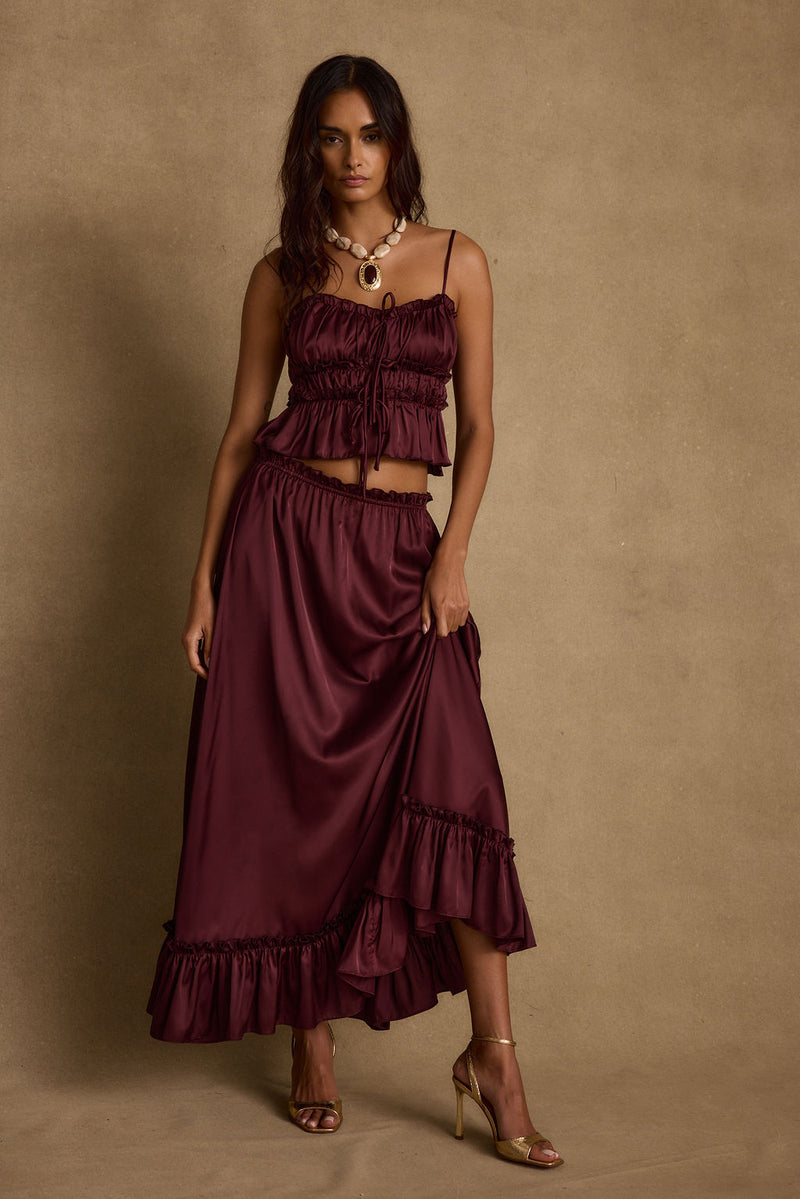 Dahlia Mulberry Satin Tank paired with complementary accessories for a polished look.