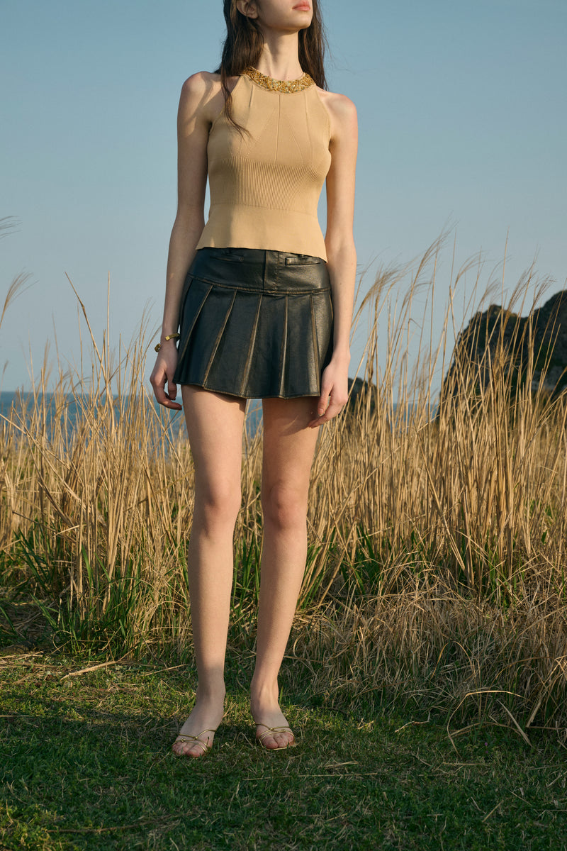 Distressed pleated mini skirt