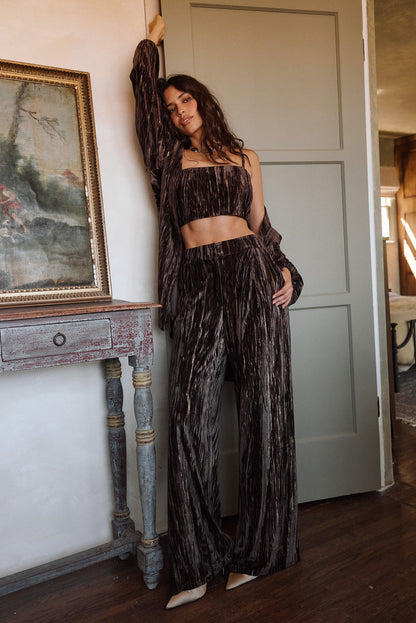 Lifestyle shot of the espresso crop top styled for day-to-night versatility.