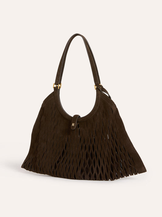 CHOUQUETTE ebony laser-cut leather bag worn on a model by Rouje